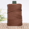 A spool of brown 3mm ice rope crochet yarn with a green plastic core.