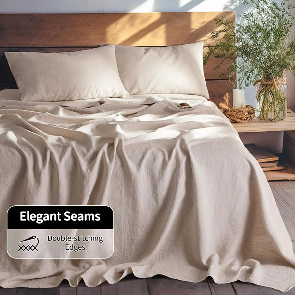 A beige linen duvet cover and pillow set with elegant double-stitched edges on a wooden bed.