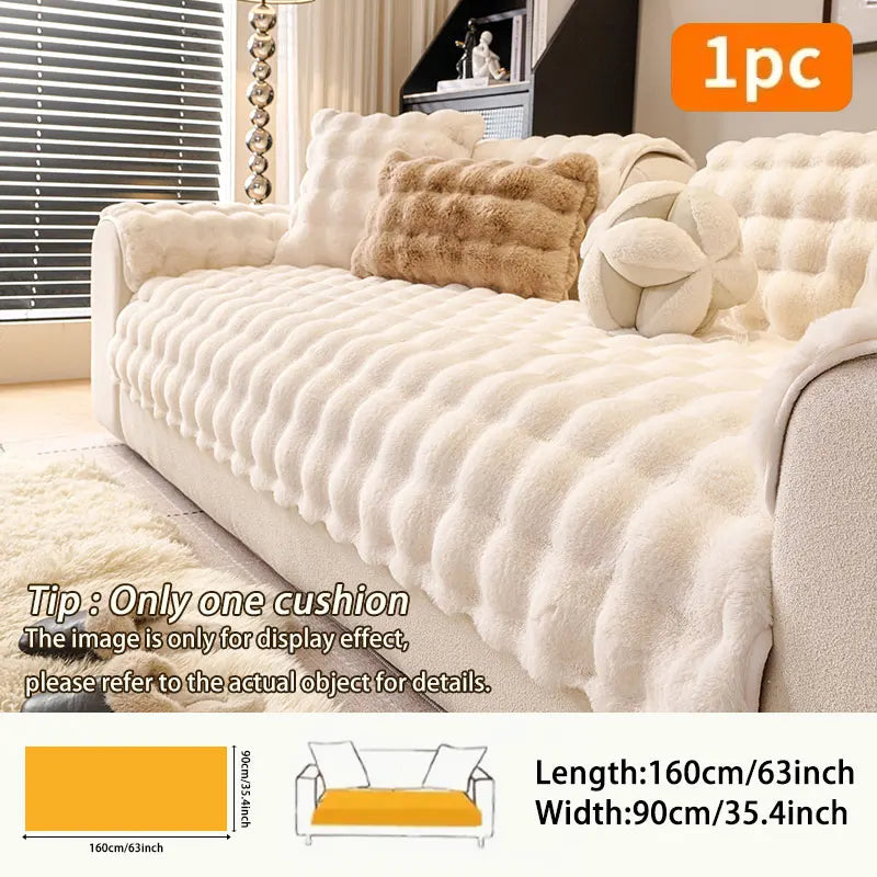 A beige plush anti-slip sofa cushion with decorative fluff and a yellow accent shown on a sofa.