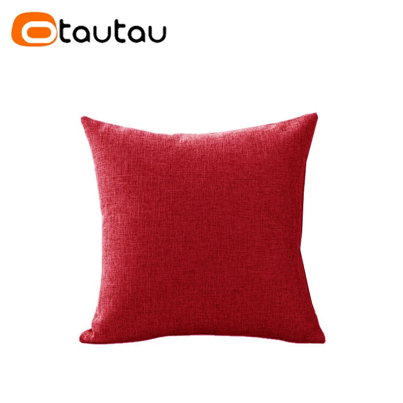 A solid red cushion cover made of soft cotton linen with a button closure.