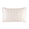 A square silk pillowcase with a pale pink background and a delicate floral print.