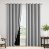 Gray blackout thermal curtain hanging in a window frame