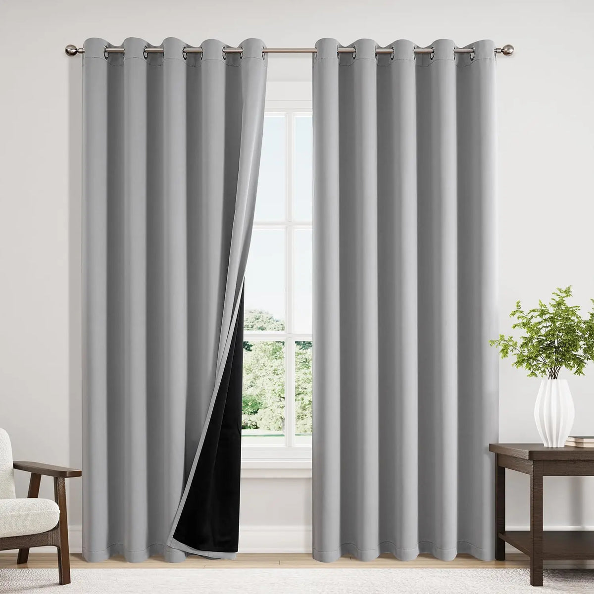 Gray blackout thermal curtain hanging in a window frame