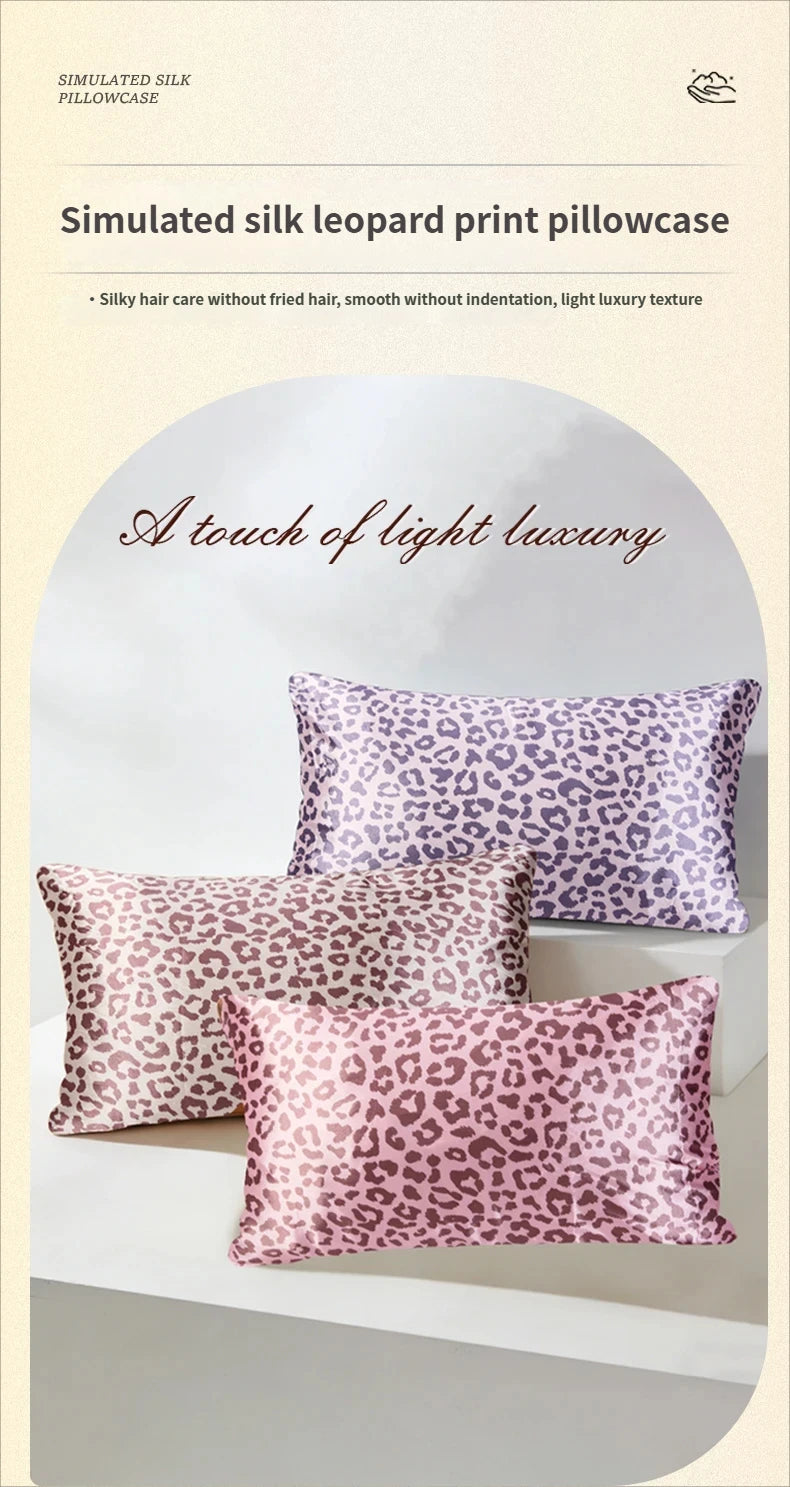 A stack of pink leopard print silk pillowcases displayed on a white surface.