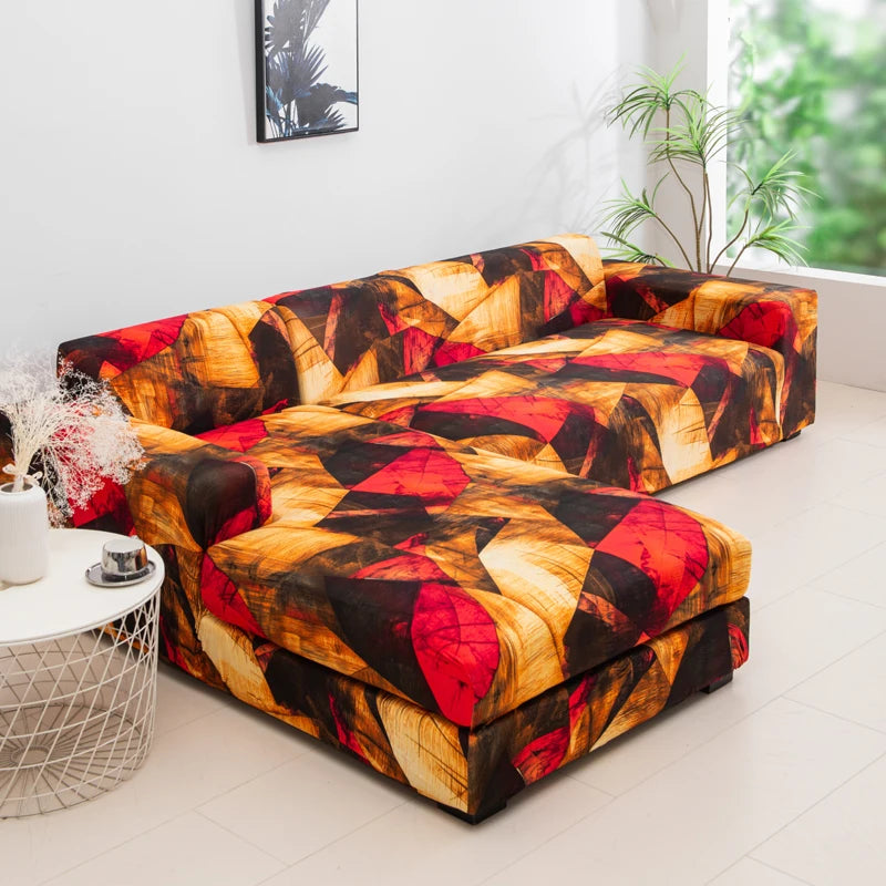 A stylish printed sofa protector cover featuring warm tones of orange, red, and black patterns.