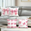 Decorative pillow covers featuring a pink bow pattern on white fabric.
