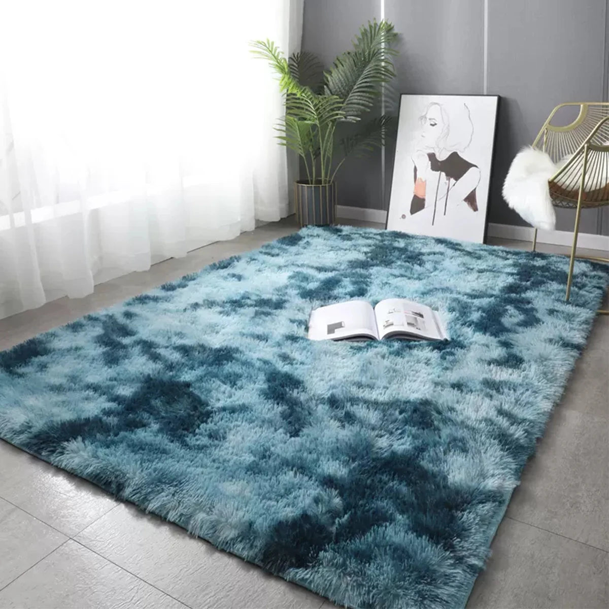 A deep teal faux fur rug placed on a floor, with an open book and a framed print nearby.