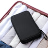 A black complete sewing kit for handicrafts and embroidery placed inside a pink carrying case with white fabric lining.