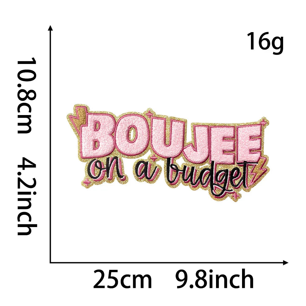 Pink embroidery patch with the text BOUJEE on a budget