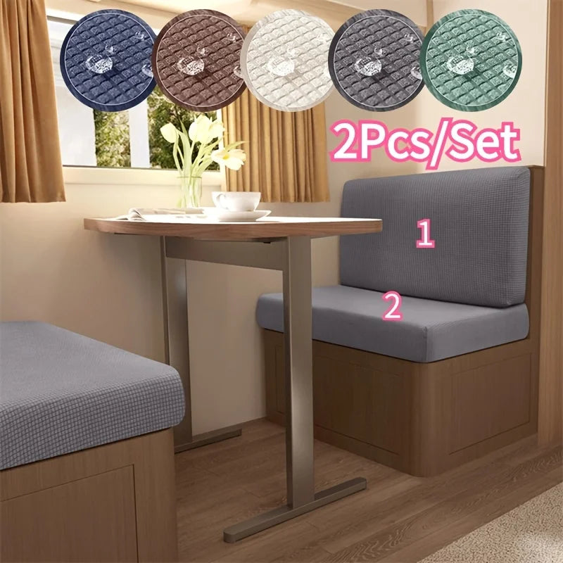 A set of six water repellent stretch sofa and chair covers in various shades of blue, brown, and green displayed on a wooden 