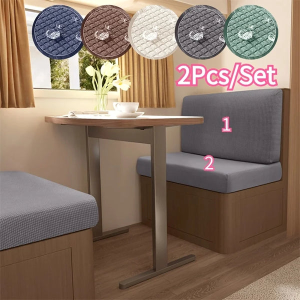 A set of six water repellent stretch sofa and chair covers in various shades of blue, brown, and green displayed on a wooden 