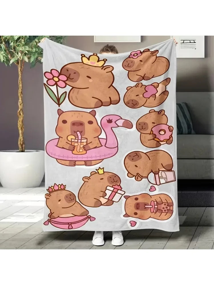 A gray flannel blanket featuring a cartoon print of cute brown bears and a pink flamingo.