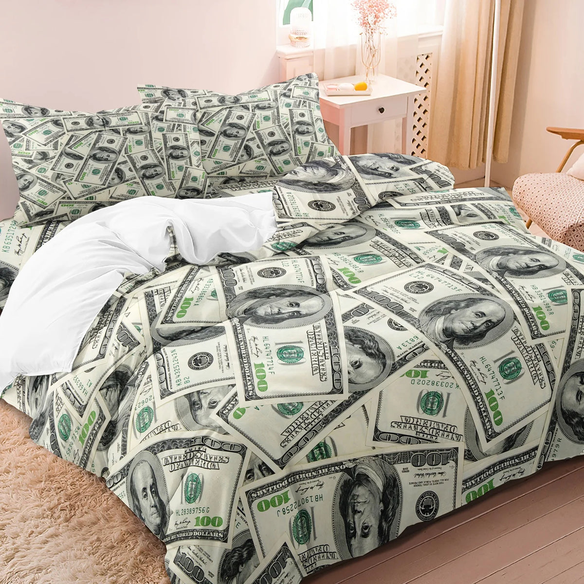 A bed with a duvet and pillowcases featuring a pattern of US hundred dollar bills.