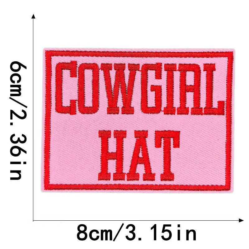 Pink embroidered patch with red text reading COWGIAL HAT