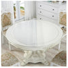 A round white PVC table with a decorative print cloth is shown in a bright room.