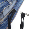 Close-up of a pair of black rope threads attached to the opening of blue denim jeans.