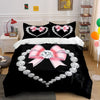 Black bedding set featuring a diamond heart print with pink bows and silver accents.