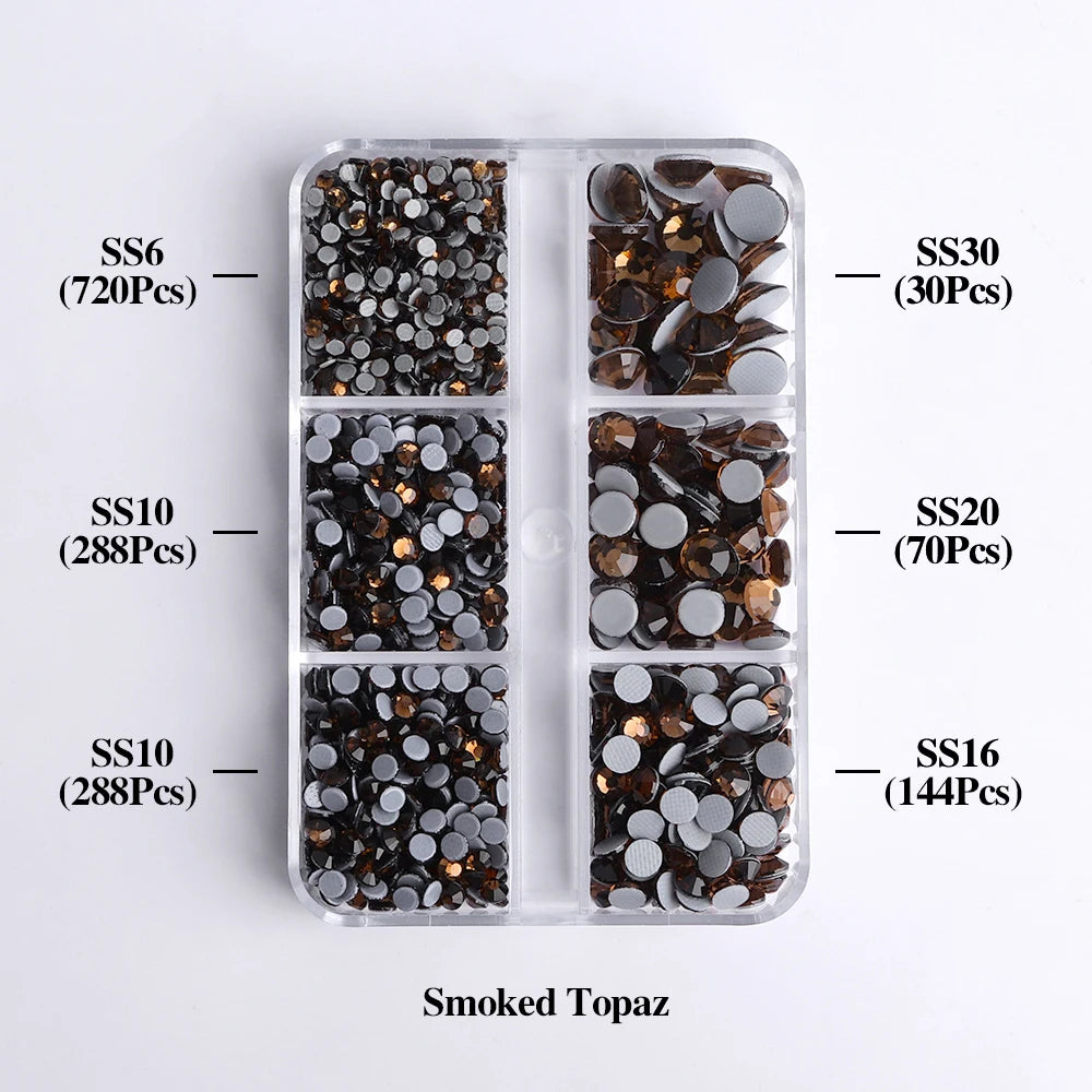 A clear plastic tray containing various sizes of smoked topaz glass rhinestones categorized by SS6, SS10, SS16, SS20, and SS3