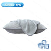 Grey ice silk cooling pillowcase shown flat with ice cubes nearby