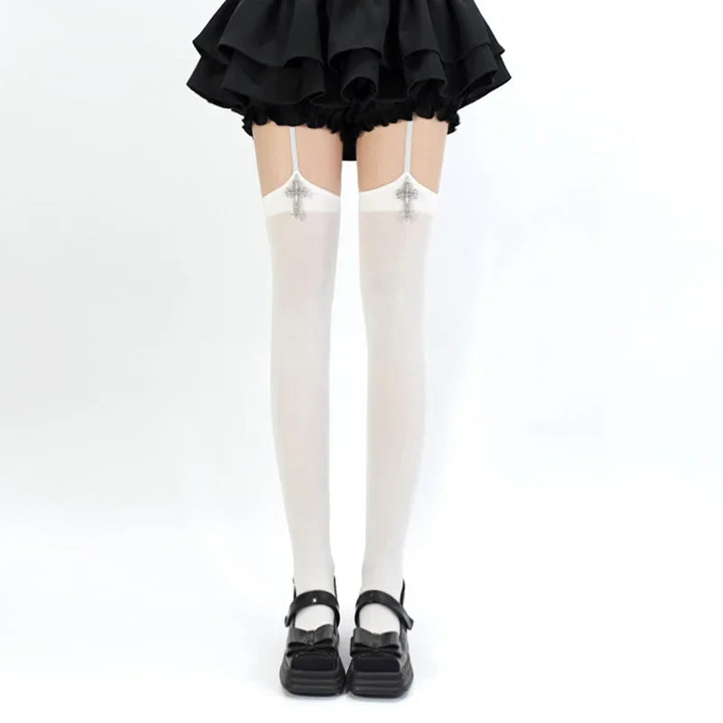 Black ruffled skirt and white suspender socks with crosses and black Mary Jane shoes