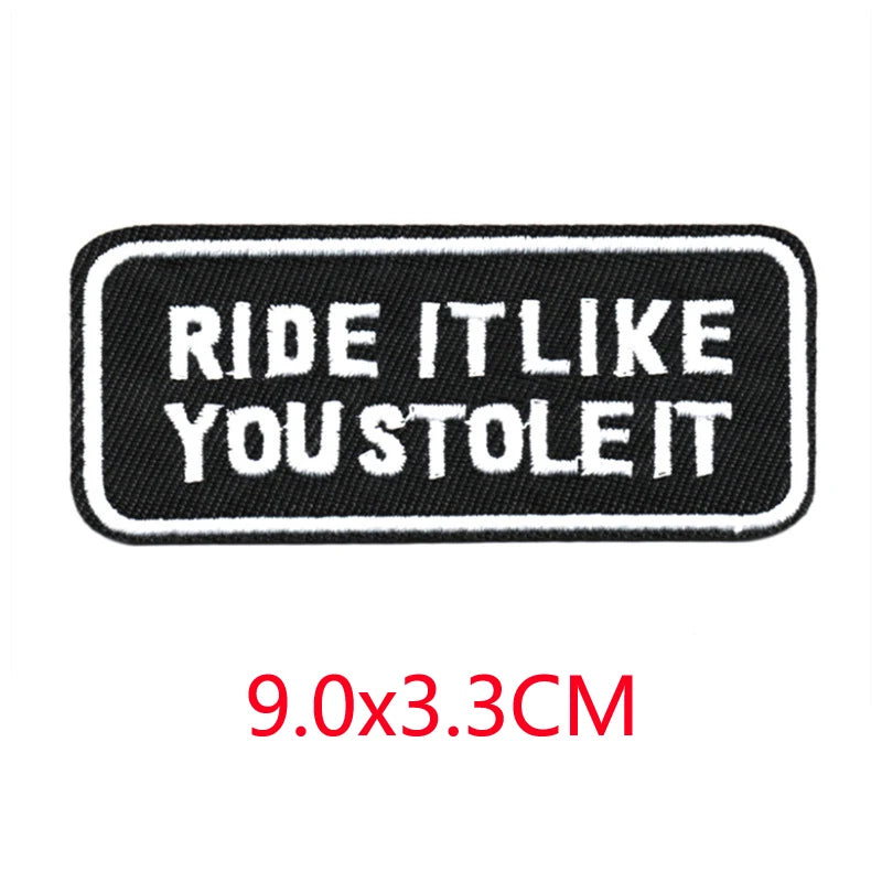 Black embroidered patch with white text that reads Ride it like you stole it