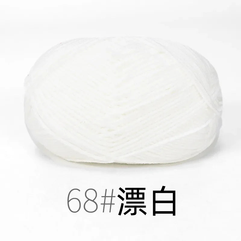 A ball of white organic cotton 4ply knitting yarn for crafts.