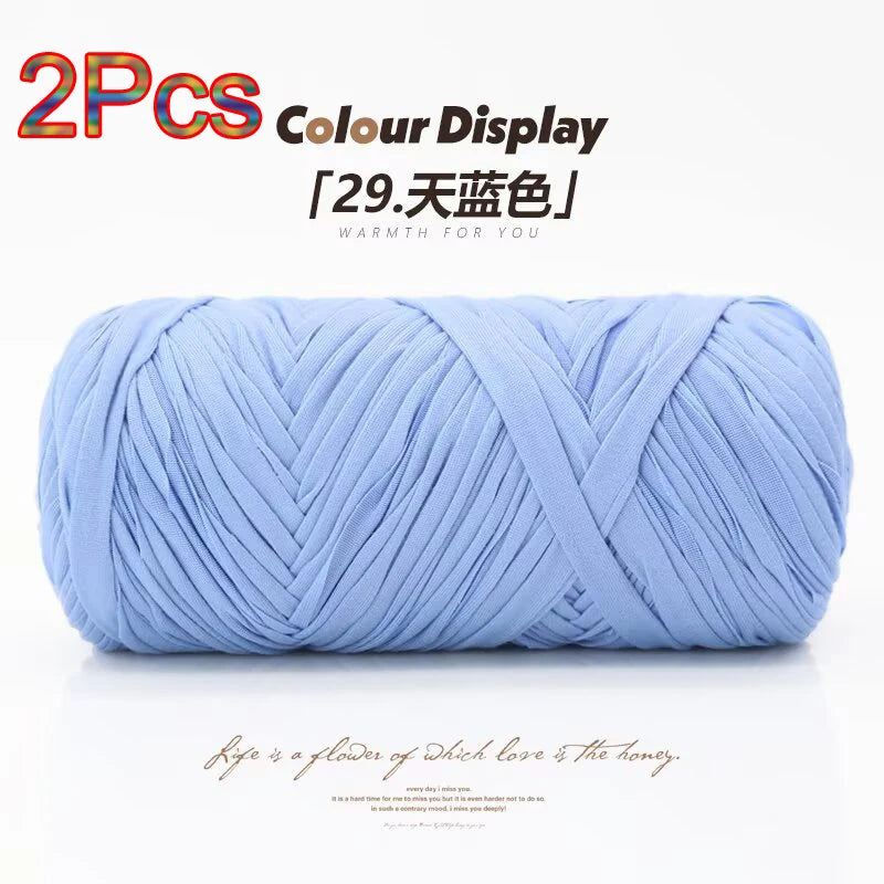 Two skeins of light blue elastic yarn used for crafting