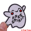 White embroidered patch of a cute ghost character with red eyes and the text FREE SPIRIT
