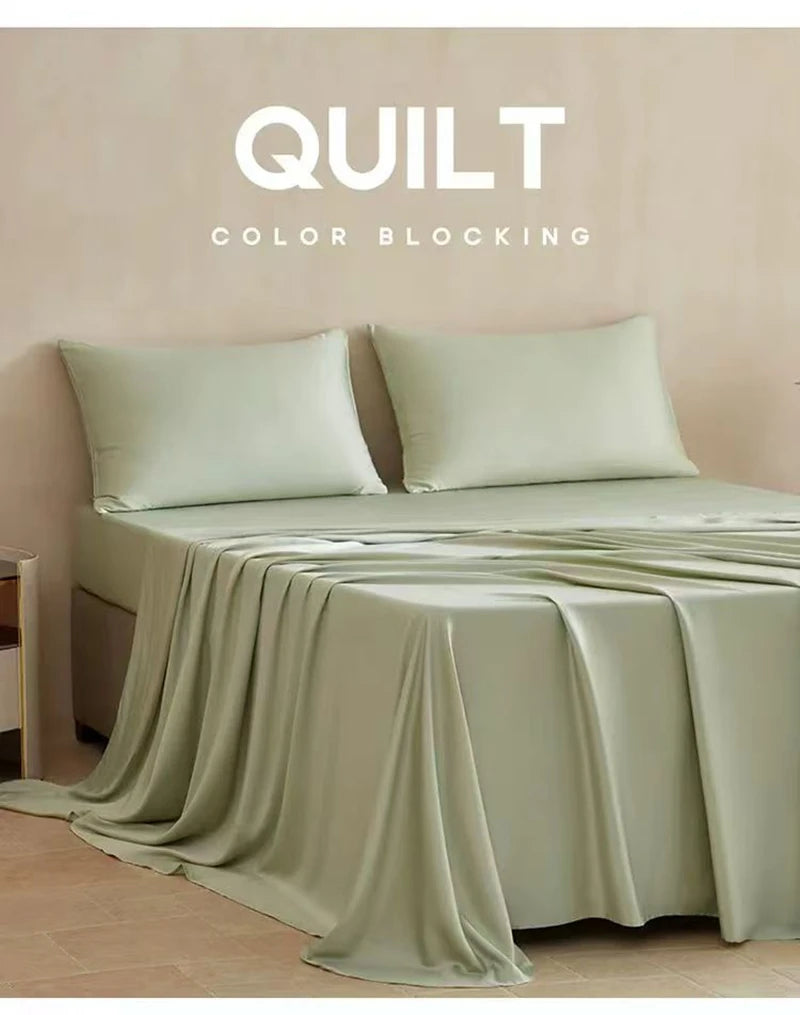 A light sage green quilt blocking fabric draped over a bed, with text reading QUILT COLOR BLOCKING.