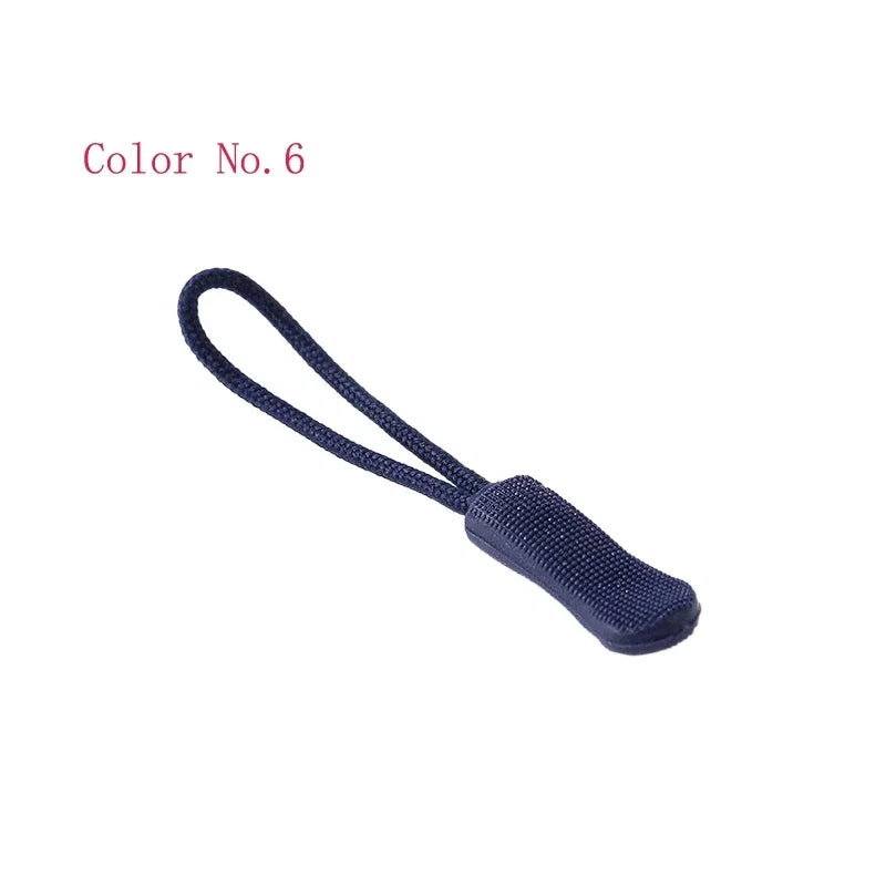 A dark blue replacement zipper pull with a cord attached, used for bags and apparel.