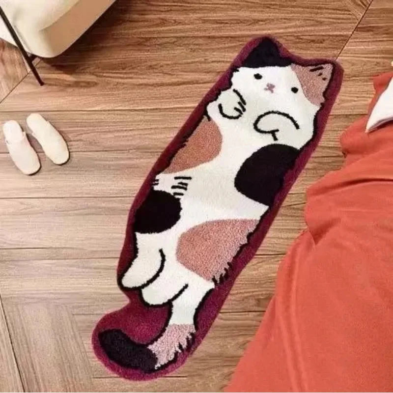 A rectangular plush rug shaped like a cartoon cat in white and brown colors resting on a wooden floor.