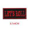 Black iron-on embroidered letter patch with red stitching that reads LET'S ROLL