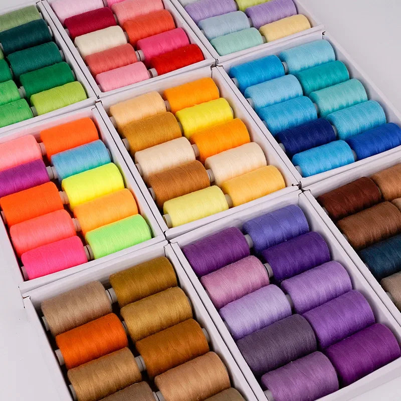A collection of 10 packs of high-quality polyester sewing thread in various bright and muted colors arranged in a white box.