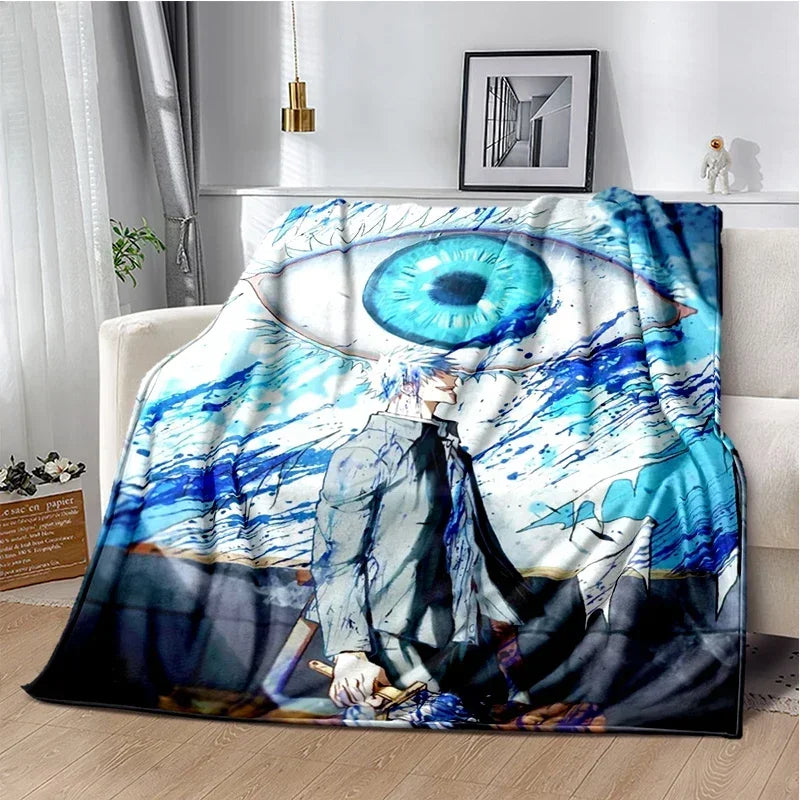A throw blanket featuring a large blue eye design with an anime character in a dark outfit.