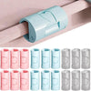A collection of pink and light blue non-slip bed sheet grippers with adjustable clips shown in various sizes.