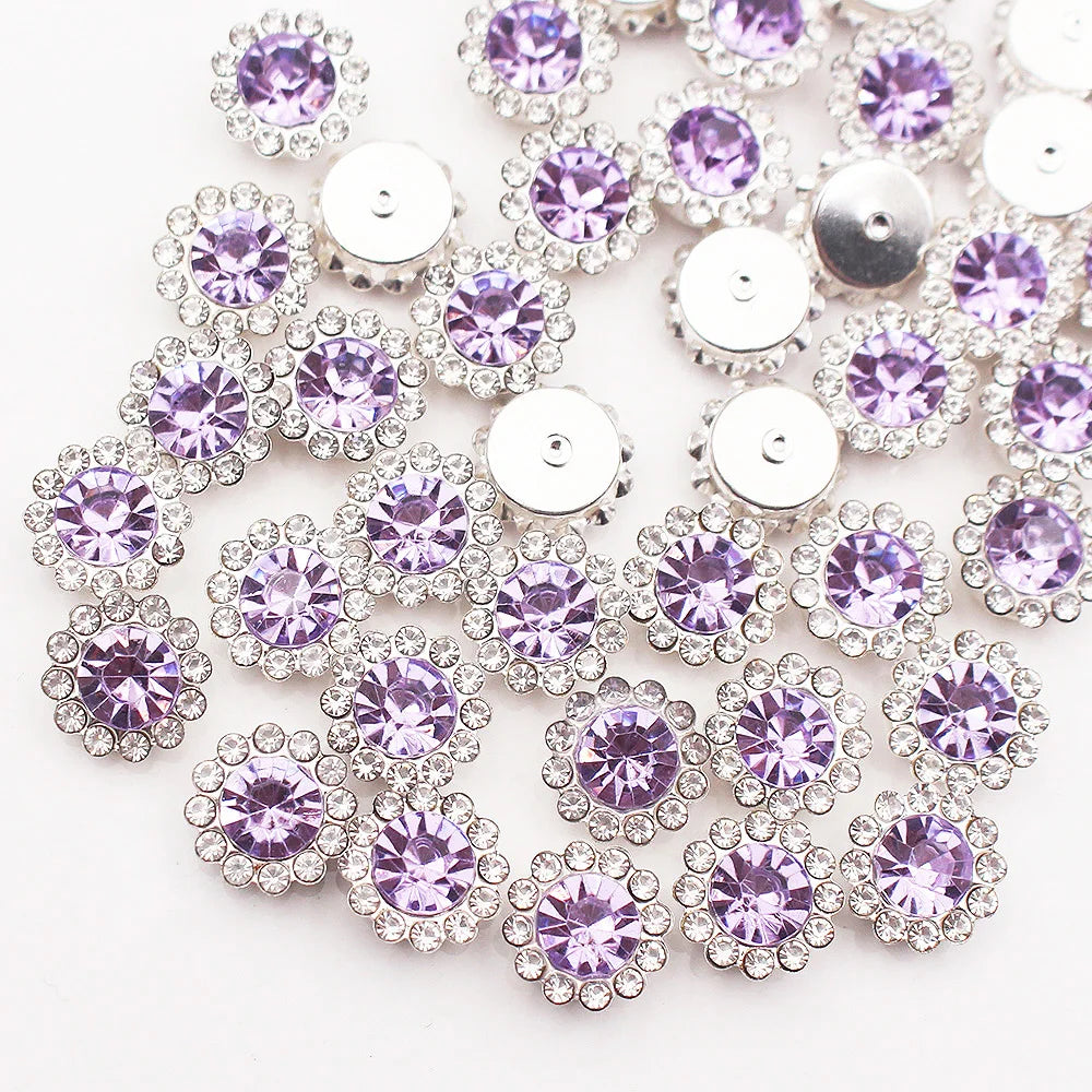 Silver and purple crystal rhinestone sew-on buttons arranged in a floral pattern