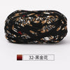 A dark brown and black patterned fabric strip yarn for crochet and knitting.