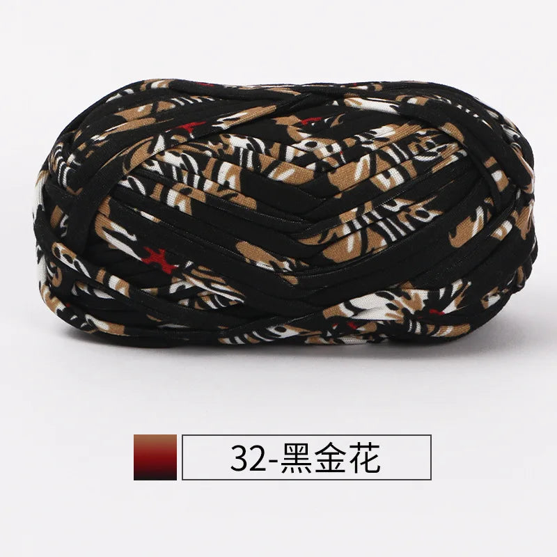 A dark brown and black patterned fabric strip yarn for crochet and knitting.