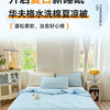 A light blue breathable waffle quilt is displayed on a bed, suggesting summer comfort.
