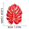 Red embroidered iron-on patch shaped like a tropical leaf with white veins.
