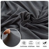 Close-up of a dark gray fabric showing the texture and drape of a sofa cushion protector cover.