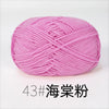 A ball of pink organic cotton 4ply knitting yarn for crafts.