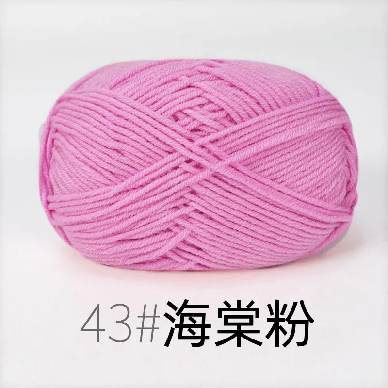 A ball of pink organic cotton 4ply knitting yarn for crafts.