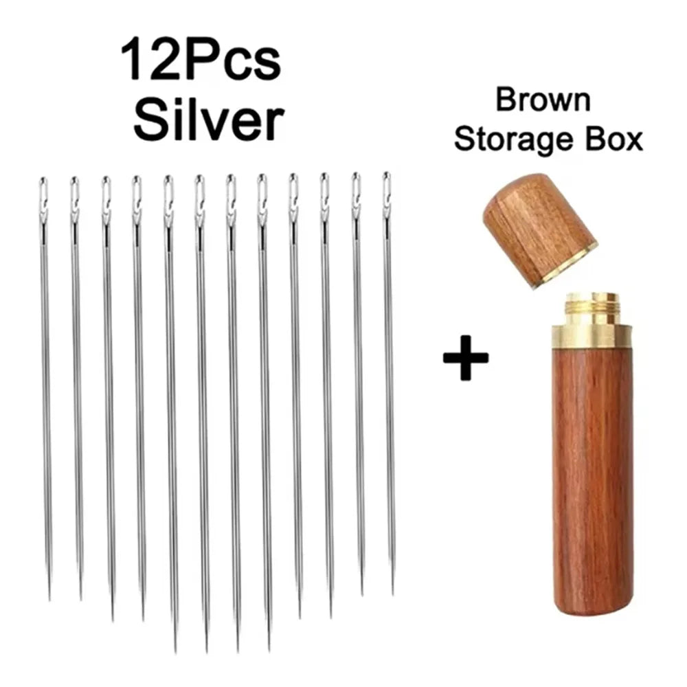 A set of 12 silver stainless steel self-threading sewing needles and a brown storage box