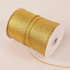 A roll of 10-meter gold and silver glitter satin ribbon with a white core.