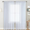 White sheer curtain with a rod pocket hanging over a window in a living room setting.