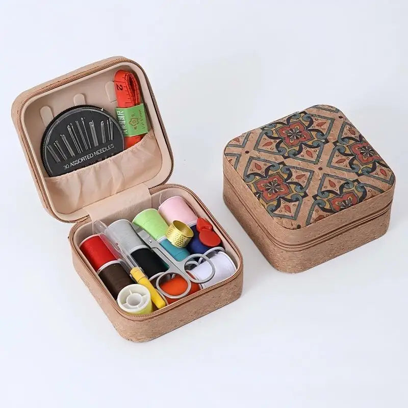 A brown storage box containing a retro style zipper sewing kit with various needles and tools.