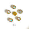 A collection of gold and clear rhinestone crystals in various flower shapes and sizes.