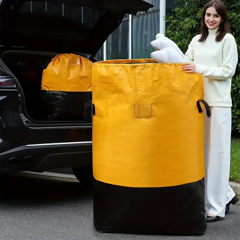 A woman holds a large yellow heavy duty waterproof storage bag next to a black car trunk.
