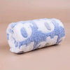 A fluffy blue and white elephant flannel pet blanket for dogs and cats.